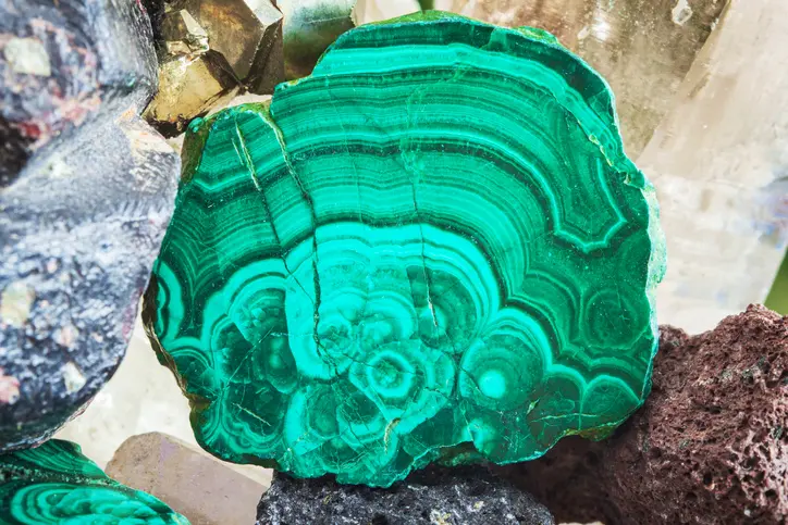 A close up of the surface of a green rock